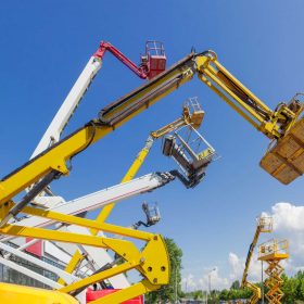 A variety of articulating lifts for sale outside