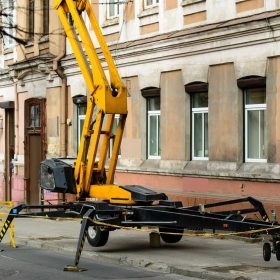 Large towable lift outside a residential building