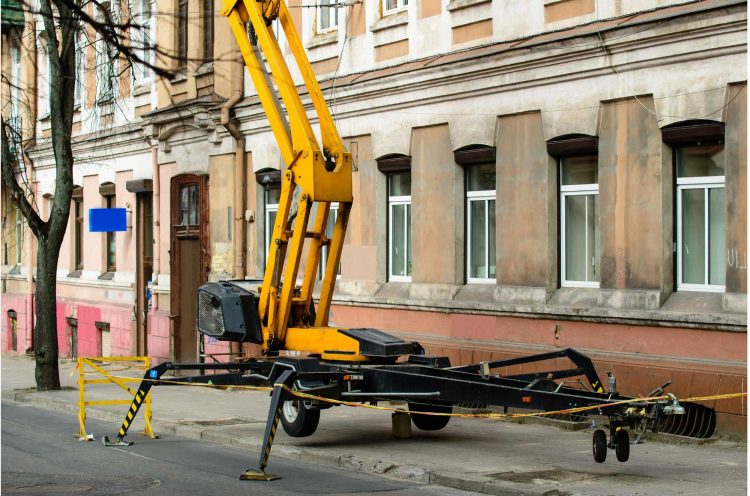 Large towable lift outside a residential building