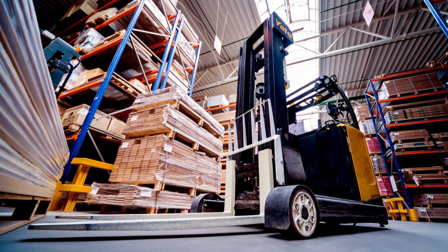 Warehouse Forklift An operator showing how to reduce forklift damage in a warehouse