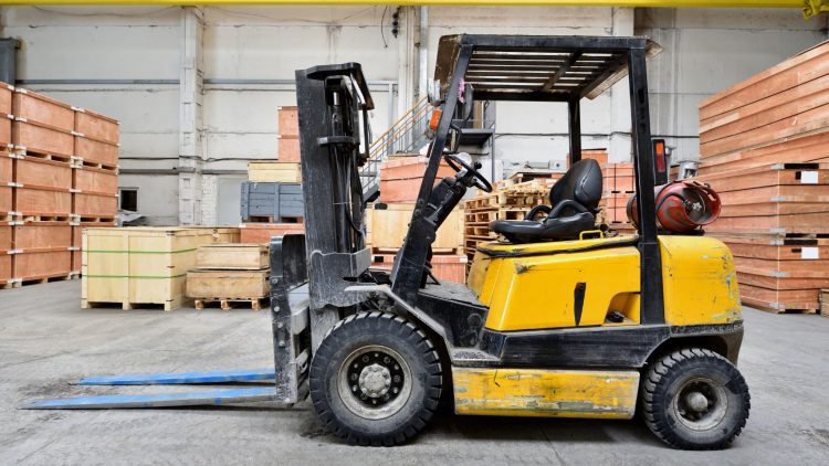 Forklift in warehouse lifting the right capacity